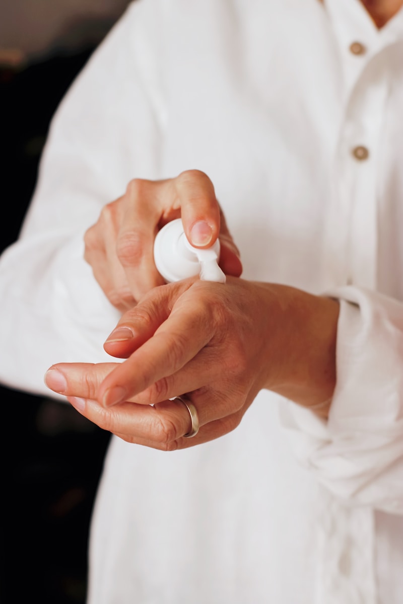 Photo by Nataliya Melnychuk person holding white round ornament